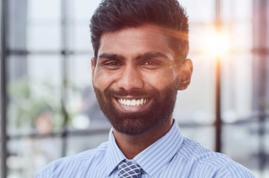 male investor beard looking at camera and smiling in modern office