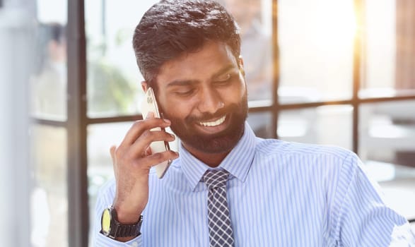 Close up portrait business man talking over cell phone.