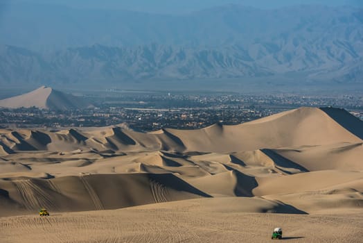 tourists with dune buggies in the peruvian coast at Ica Peru