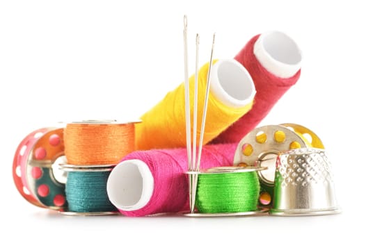 Composition with tailor needles and threads over white background