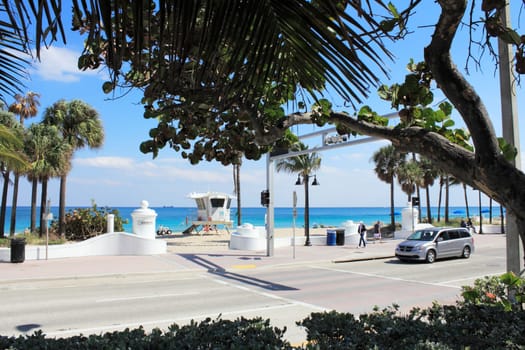 FORT LAUDERDALE, FLORIDA - MARCH 3, 2013: Across State Road A1A from the entrance to Sebastian Beach at the end of Sebastian Street on a sunny day with lifeguard tower #8 just inside the opening.
