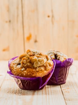 Freshly baked golden muffins for breakfast with nuts , bran and muesli for a healthy start to the day