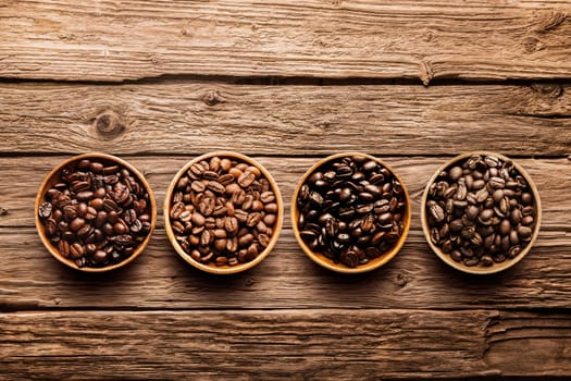 Assorted raw and roasted coffee beans in small individual containers on a rustic, weathered textured driftwood background, overhead view with copyspace