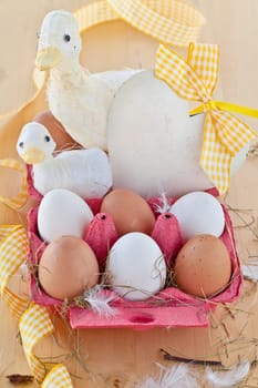 Red cardboard box with eggs and decorations for Easter