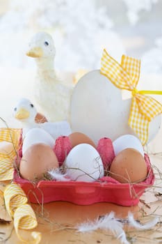 Red cardboard box with eggs and decorations for Easter