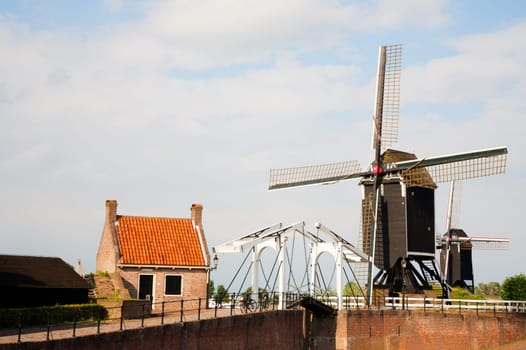 Windmill and drawbridge in Heusden  a fortified town in the Netherlands.