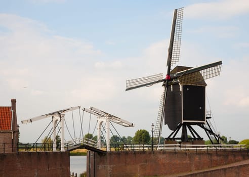 Windmill and drawbridge in Heusden  a fortified town in the Netherlands.