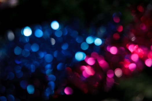 Abstract christmas background. Holiday colored lights unfocused