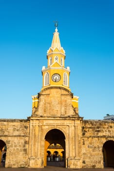 Vertical view of the clock tower gate at sunrise in the historic center of Cartagena, Colombia