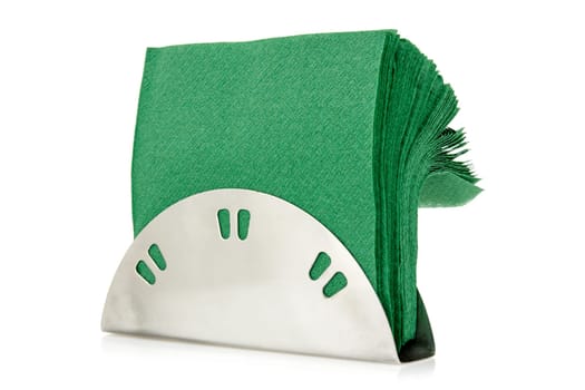 Table napkin holder with green napkins, isolated on white background