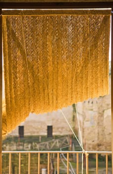 Blinds made from grass cord or esparto for windows. Andalusian traditional artwork, Cordoba, Spain