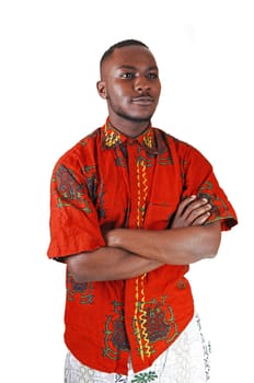 A handsome young black man in a colorful shirt and his hands crossed.over his chest, looking up for white background..