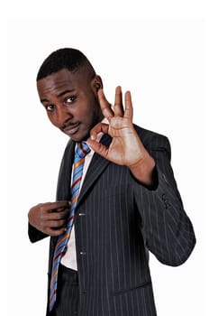 A black young man standing for white background showing with his hand all.is OK..