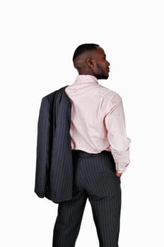 A black business man standing from the back for white background with his .suit jacket over his shoulder..