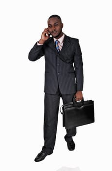 A talking black young man in a blue suit and briefcase standing for white.background..
