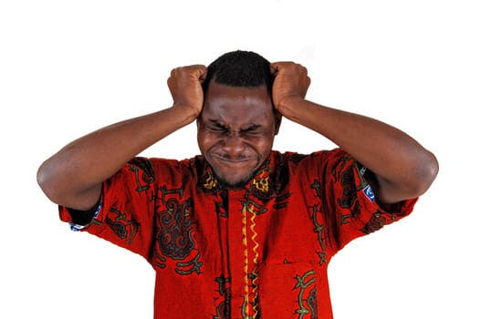 A young black man standing for white background with his hand on his.head, looking very sad..