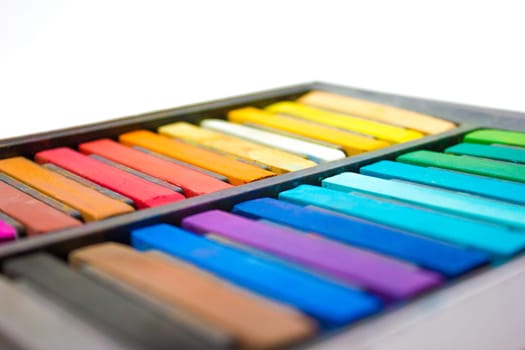 Different colors of pastels in their casing.