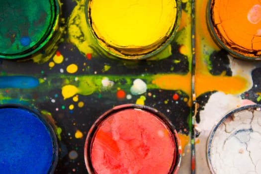 Artistic use of watercolor paint palette.