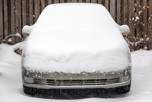 Car covered in several inches of snow in Chicago