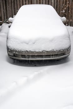 Car covered in snow in a blizzard in Chicago