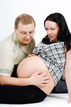 Young happy parents. Husband and pregnant wife