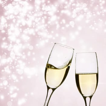 Glasses of champagne on background with blurred lights