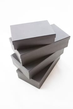 Black packaging boxes on a white background.