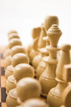 Chess pieces on a board in different compositions.