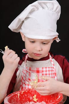 boy in chef hat knead the dough