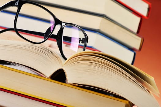 Composition with glasses and books on the table