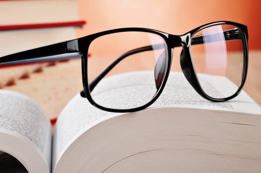 Composition with glasses and books on the table
