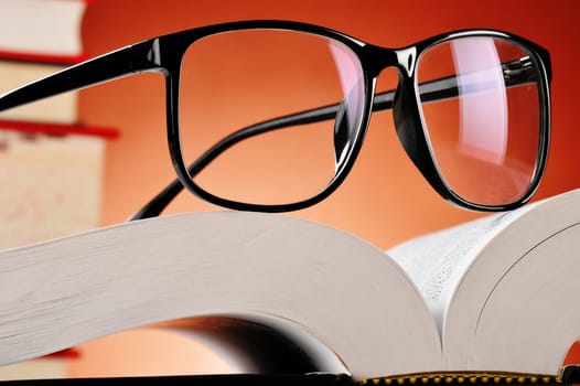 Composition with glasses and books on the table