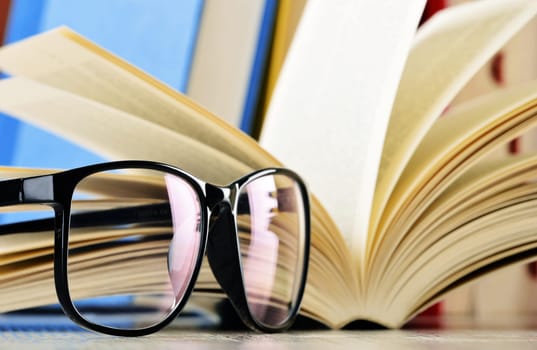 Composition with glasses and books on the table