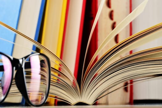 Composition with glasses and books on the table