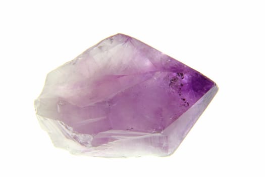 Amethyst crystal exposed against a white background
