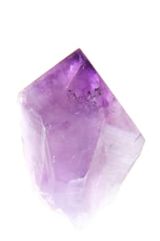 Amethyst crystal exposed against a white background