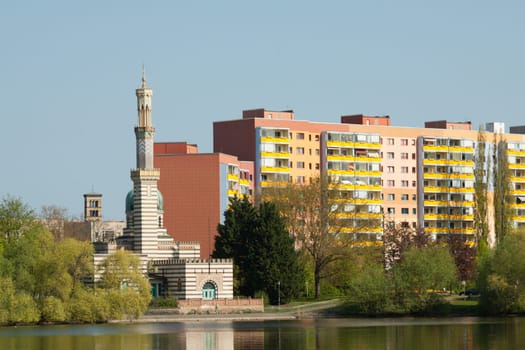 Mosque (pumping station) in front of a prefabricated apartment block