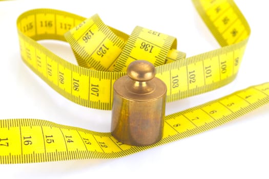 Brass weight with tape measure in detail