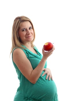 Details of a pregnant woman with an apple isolated on white background.