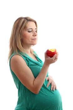 Details of a pregnant woman with an apple isolated on white background.