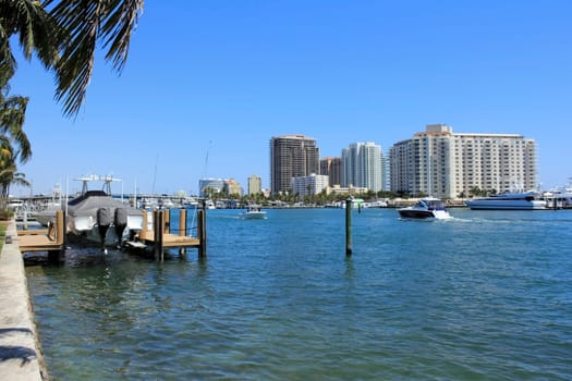 FORT LAUDERDALE, FLORIDA - MARCH 30, 2013: People with small boats cruising on the beautiful Atlantic Intracoastal waterway south of Las Olas Boulevard bridge on a sunny day in winter.