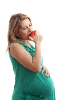 Details of a pregnant woman with an apple isolated on white background.