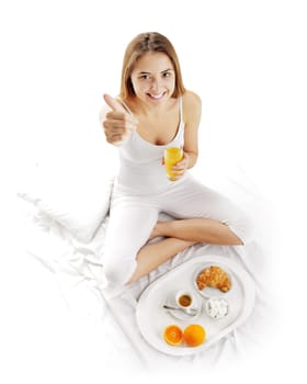 Woman waking up to breakfast in bed