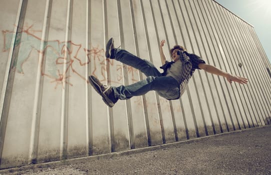 Young man falling from a building