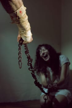 Chained slave woman,  prisoner of an evil man