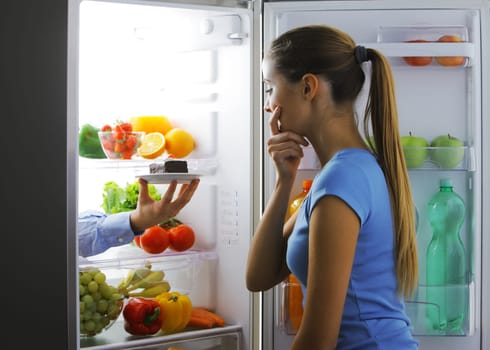 Woman contemplating if she should ruin her diet