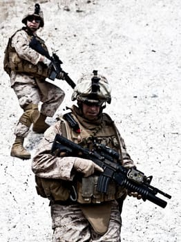 Two soldiers in the mountains during the military operation