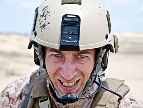 Scary face of US marine in the MARPAT uniform showing teeth