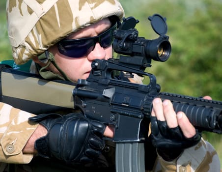 British soldier in camouflage uniform in action