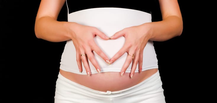 Close up shot of a beautiful pregnant belly